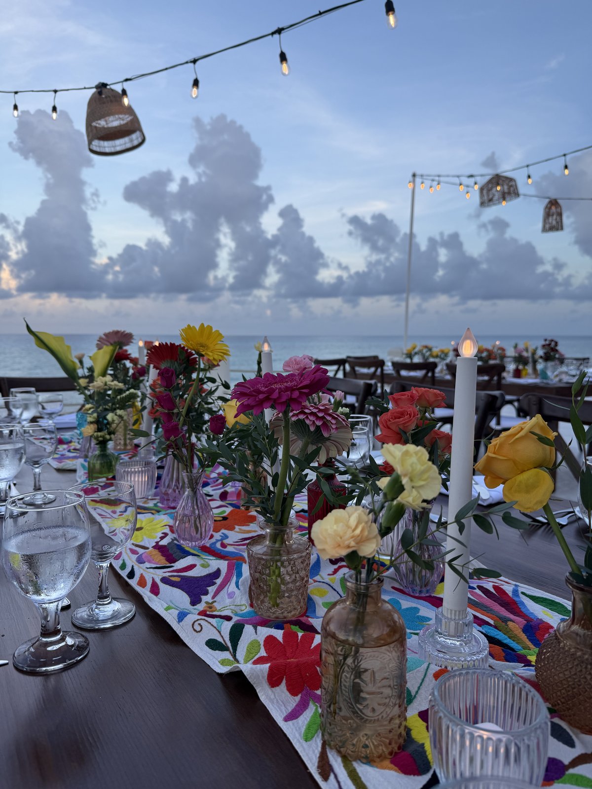 Beachfront wedding dinner setup in Mexico